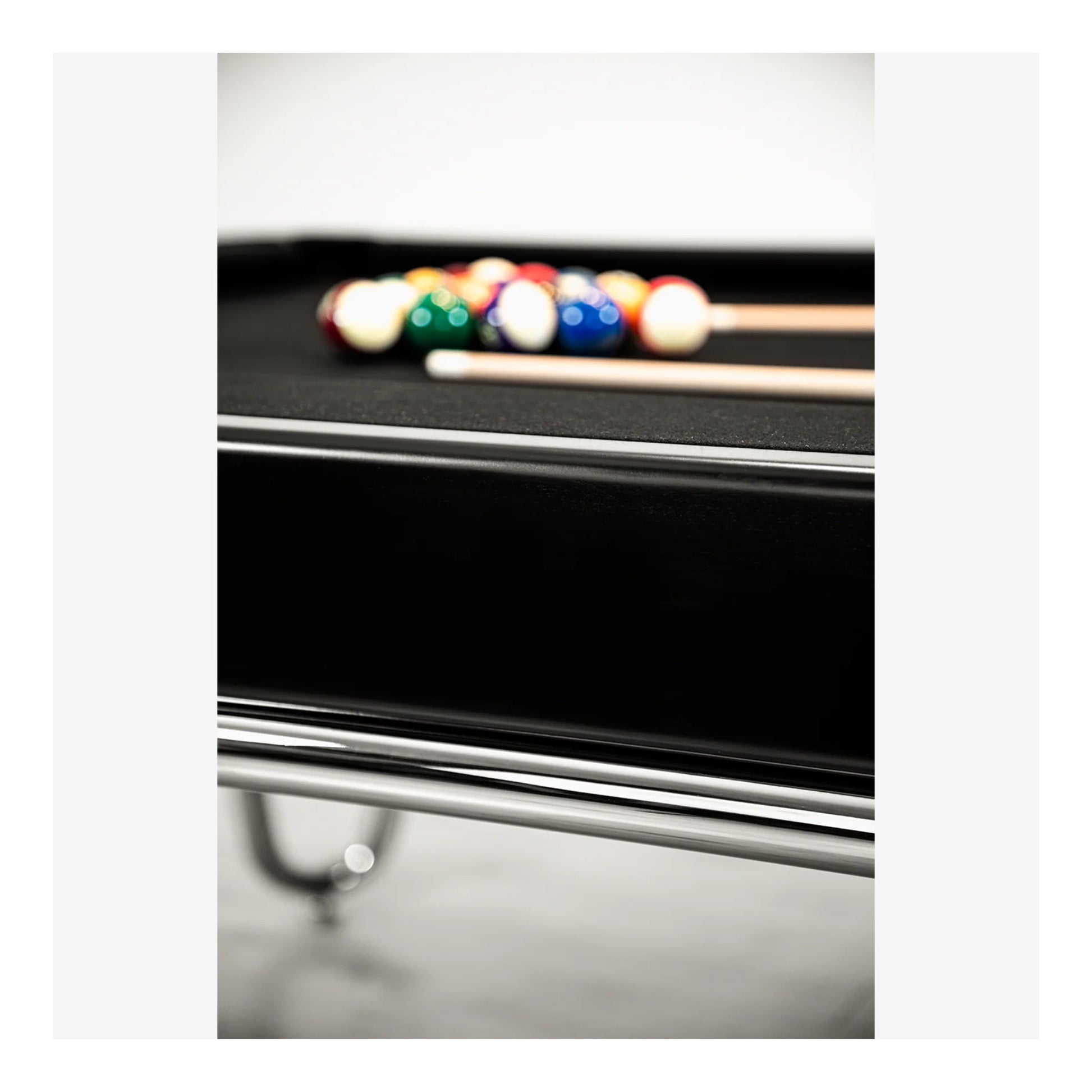 Pool table with pool balls and cues on a white background