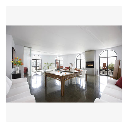Modern living room with a pool table and white furniture