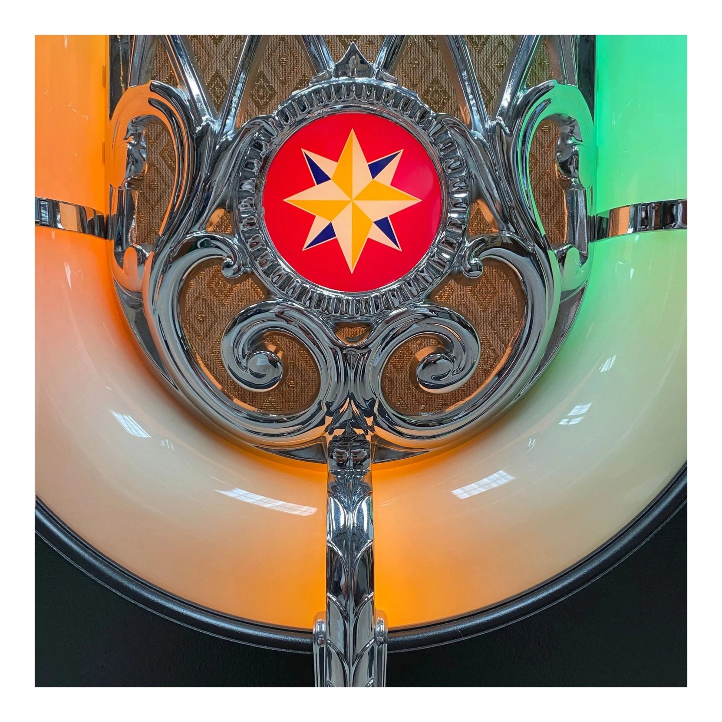 Decorative object with a star emblem on a colorful background
