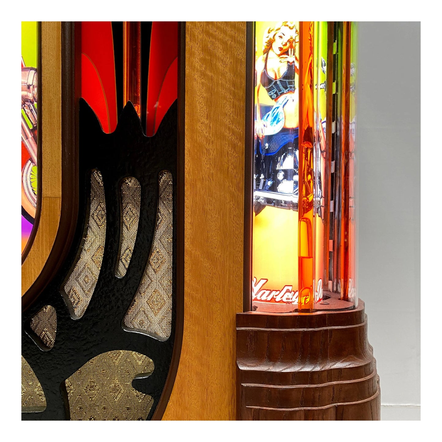 Close-up of a colorful arcade machine with detailed woodwork and vibrant graphics.