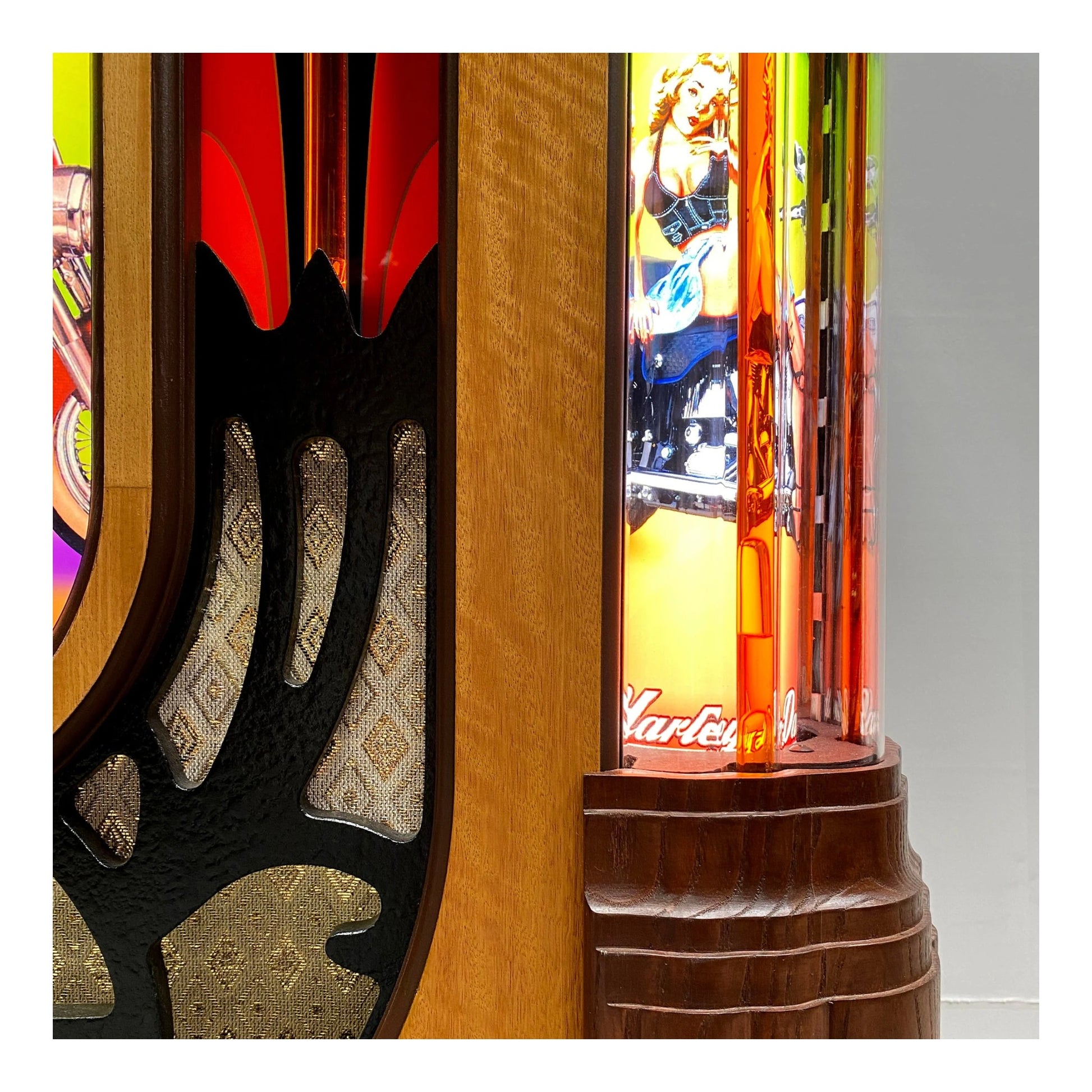 Close-up of a colorful arcade machine with detailed woodwork and vibrant graphics.