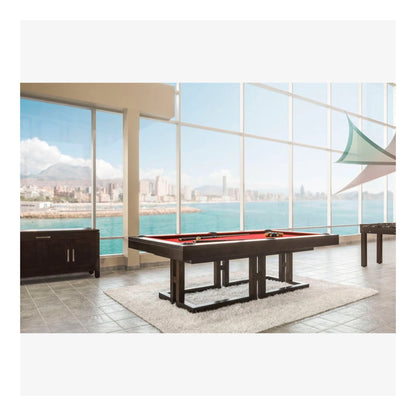 Pool table in a room with large windows overlooking water and mountains