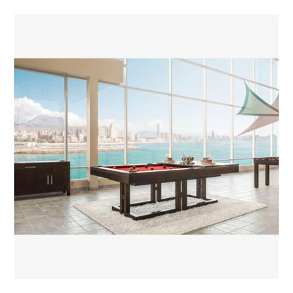 Pool table in a room with large windows overlooking water and mountains