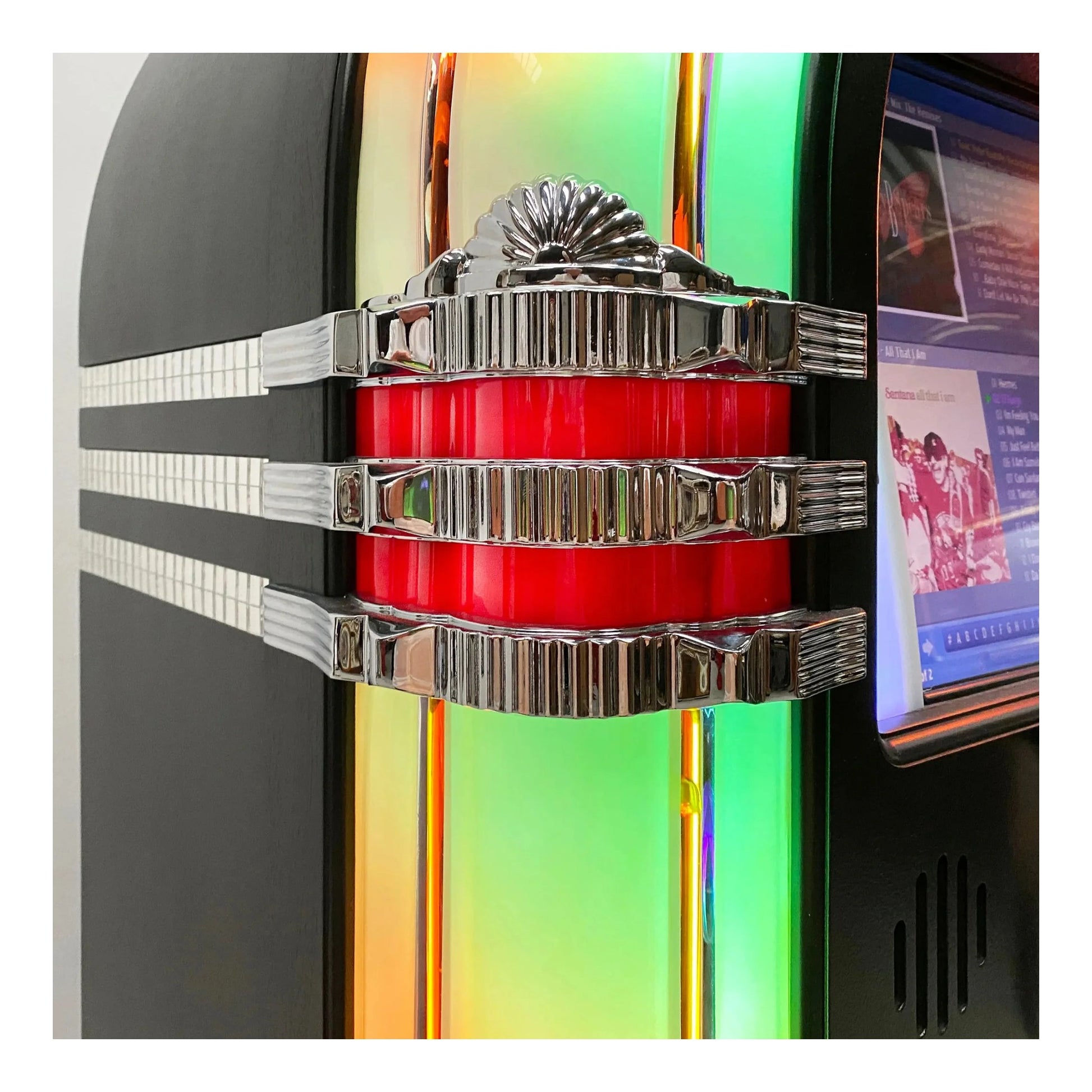 Close-up of a vintage jukebox with colorful stripes and a screen displaying a video.