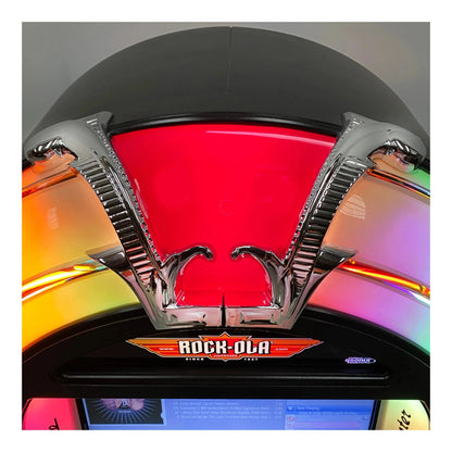 Close-up of a Rock-Ola arcade machine with colorful lights and branding.