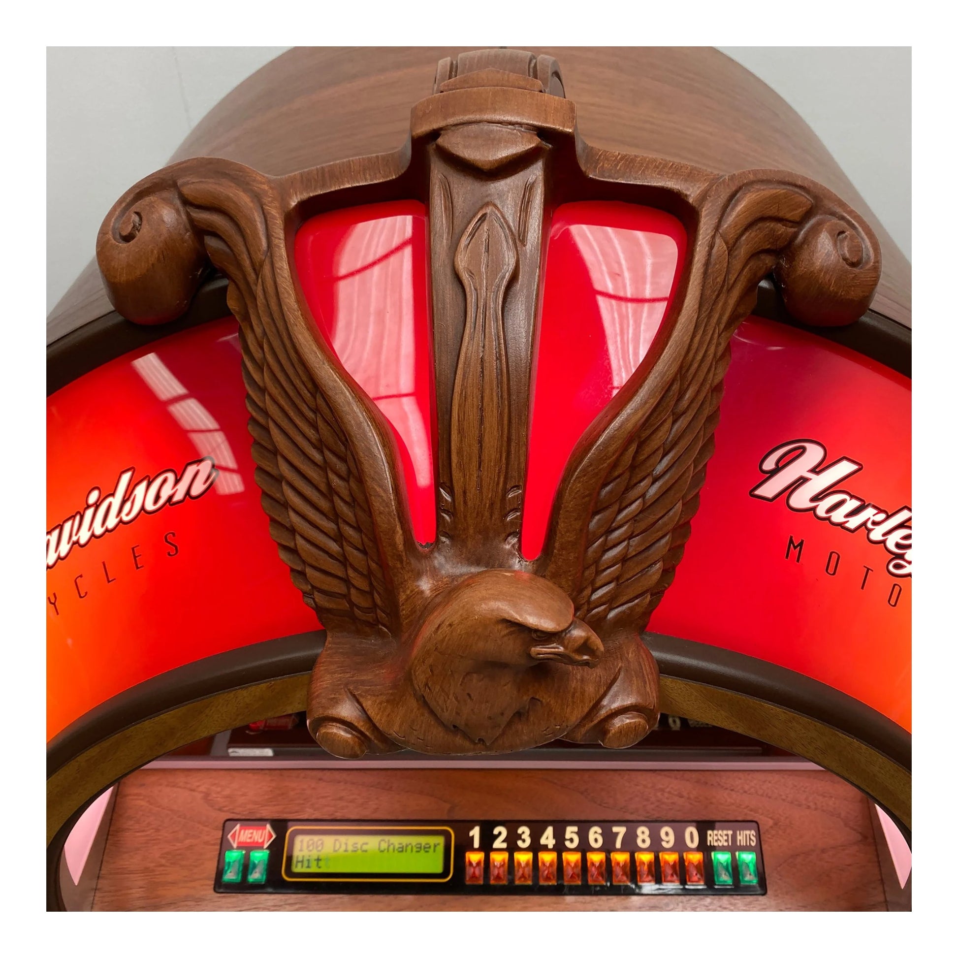 Close-up of a Harley Davidson motorcycle headlight with wooden emblem