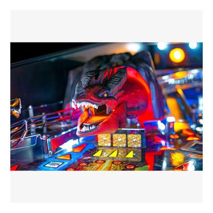 Close-up of a pinball machine with a dragon head design.