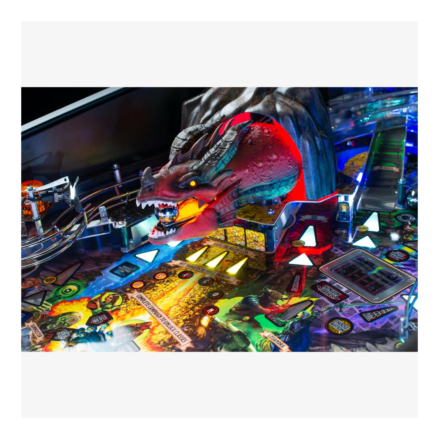 Close-up of a colorful pinball machine with a dragon figure.