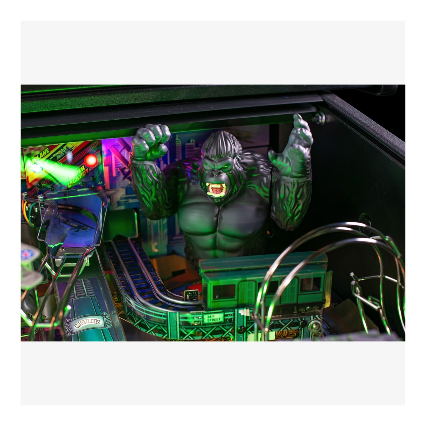 Pinball machine with a green superhero figure in the playfield