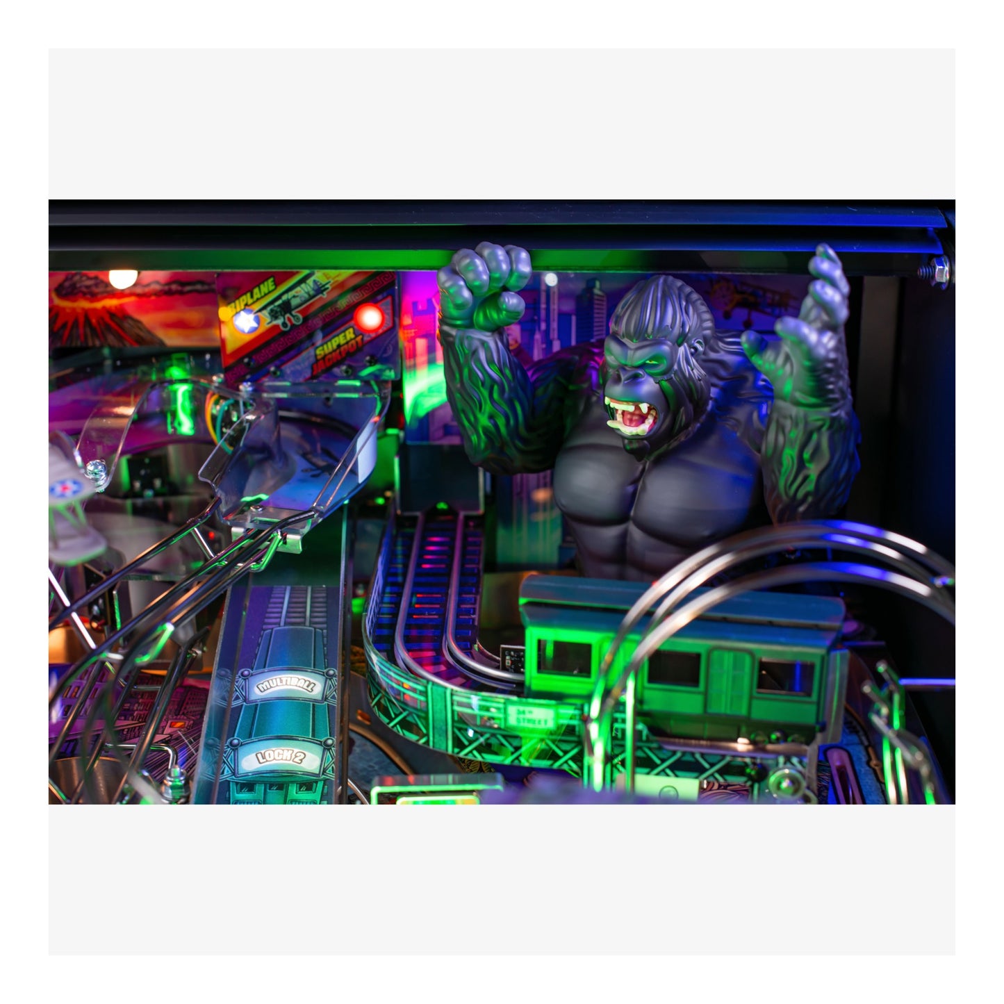 Pinball machine with a character figure in a vibrant, colorful setting