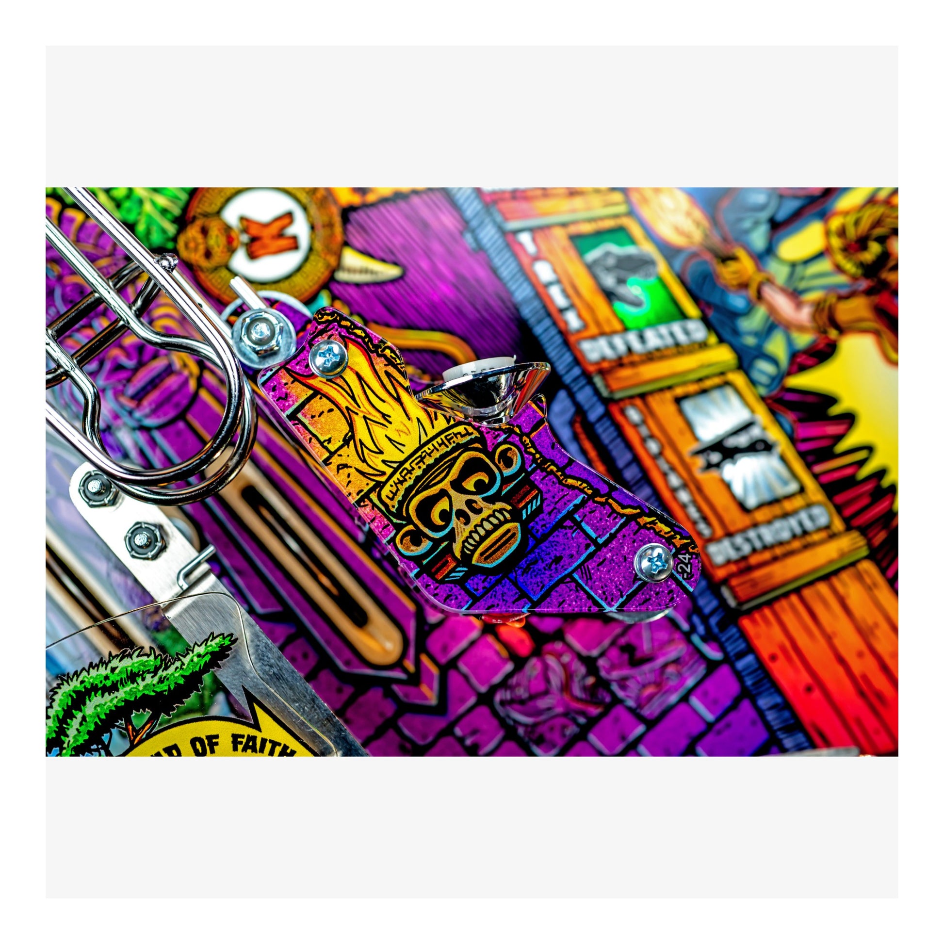 Colorful pinball machine with detailed artwork and a tiki mask design.