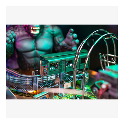 Toy train on a miniature railway set with vibrant colors and detailed scenery.