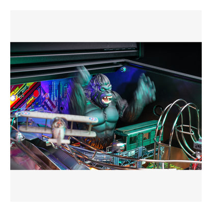 Pinball machine with a large green monster figure and colorful background