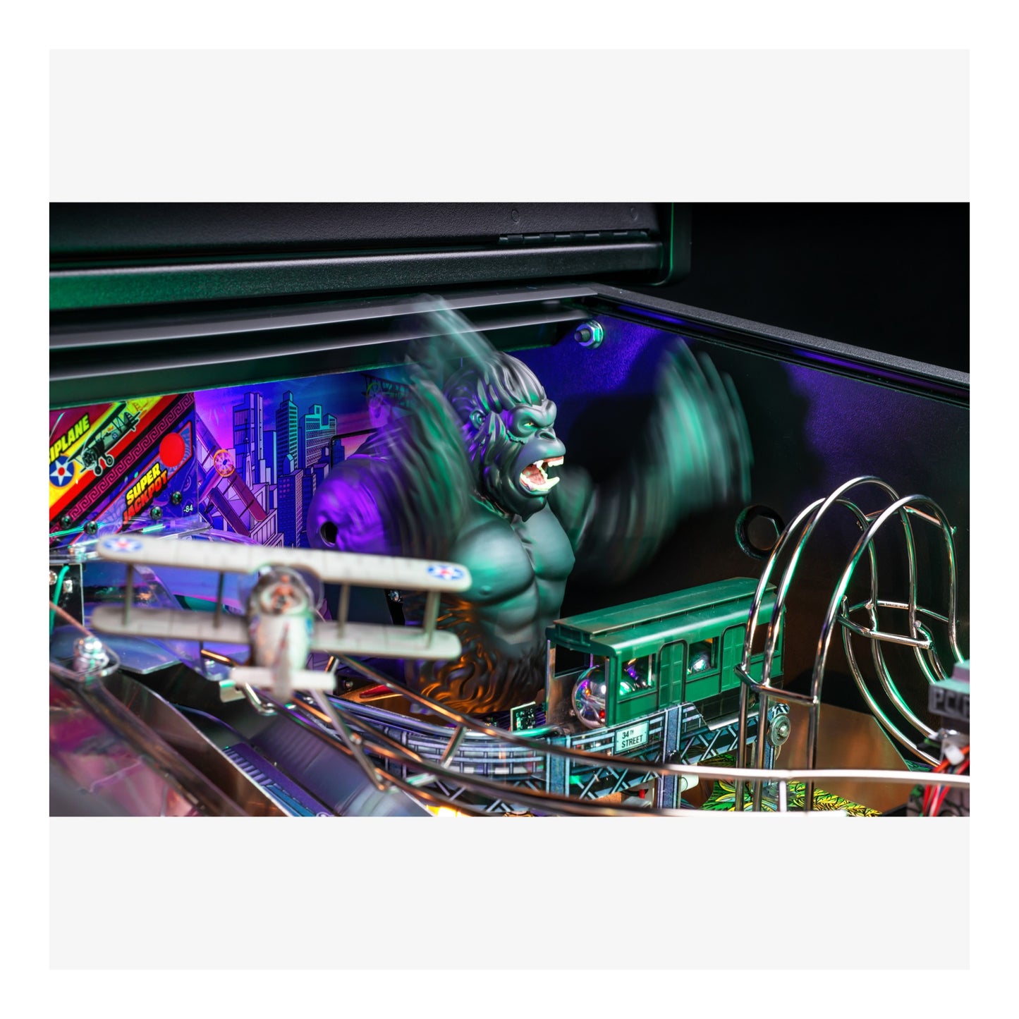 Pinball machine with a green monster figure and colorful playfield