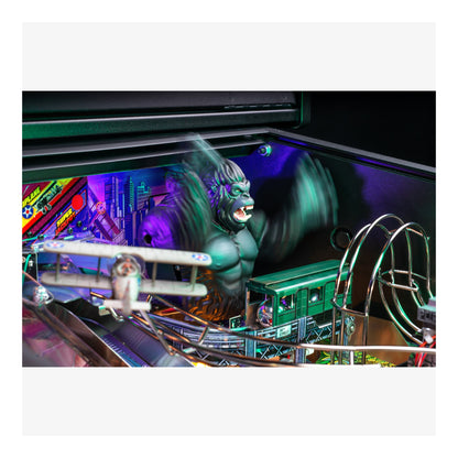 Pinball machine with a green monster figure and colorful playfield