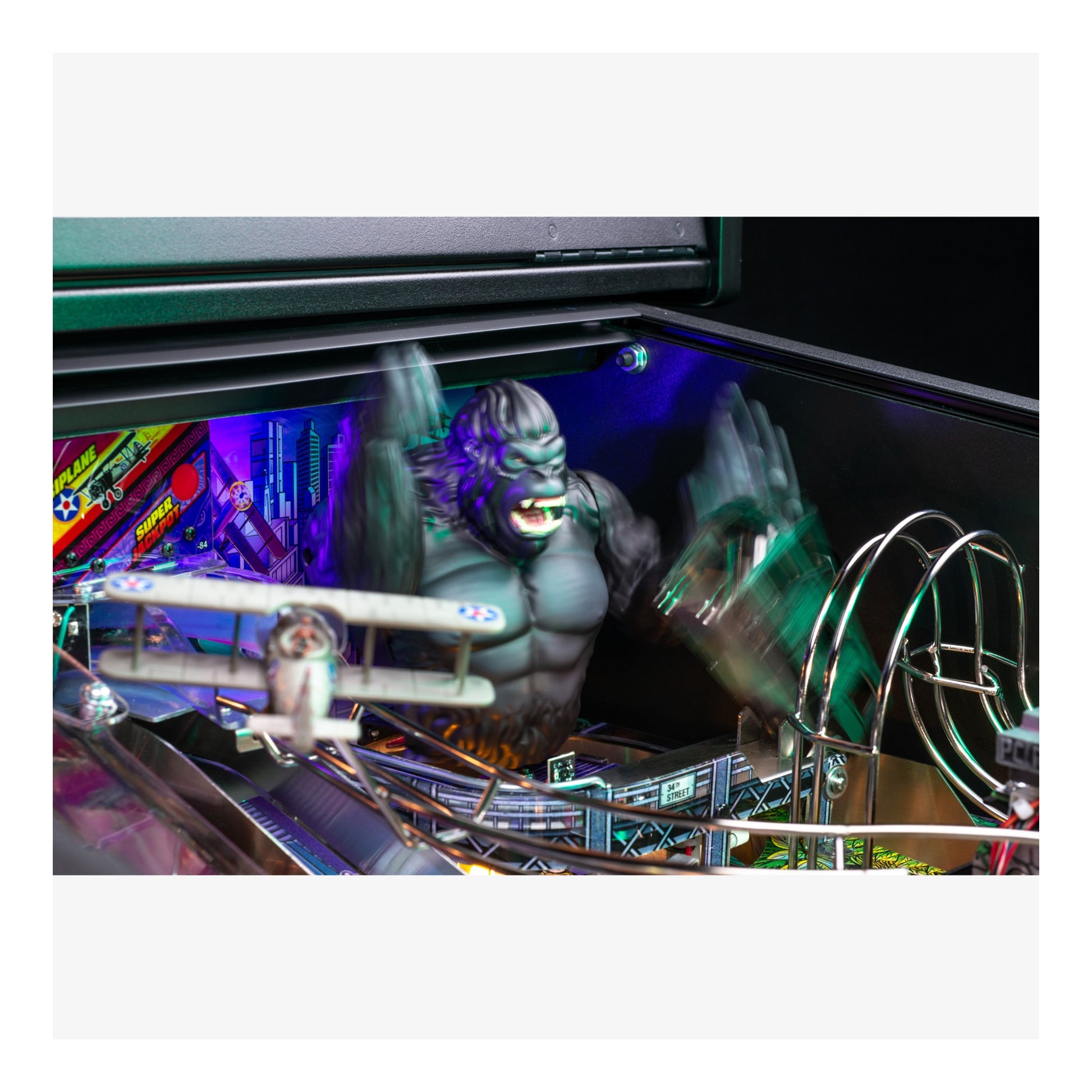 Pinball machine with a large monster figure and colorful playfield