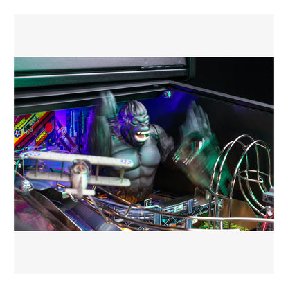 Pinball machine with a large monster figure and colorful playfield