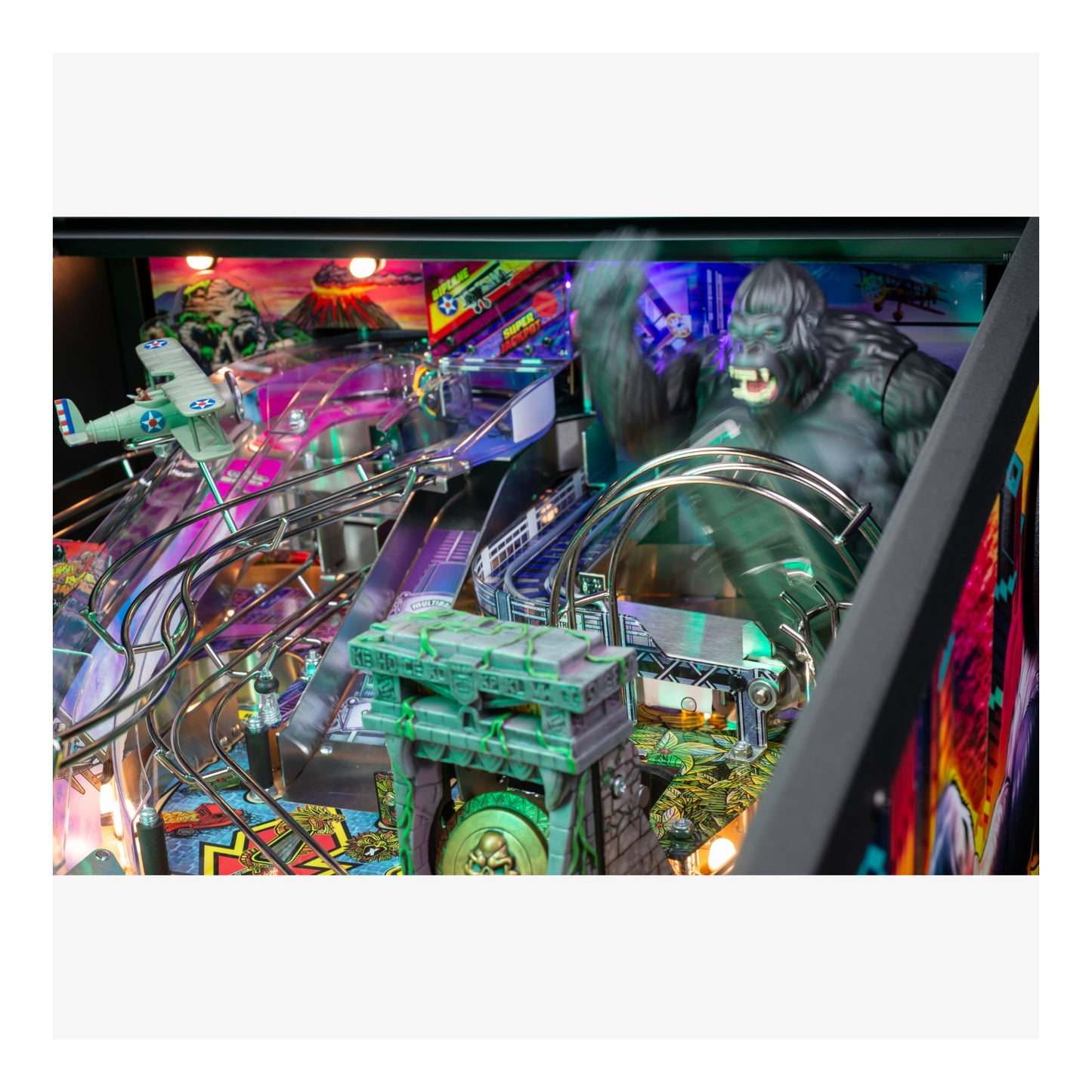 Pinball machine with colorful design and character on playfield