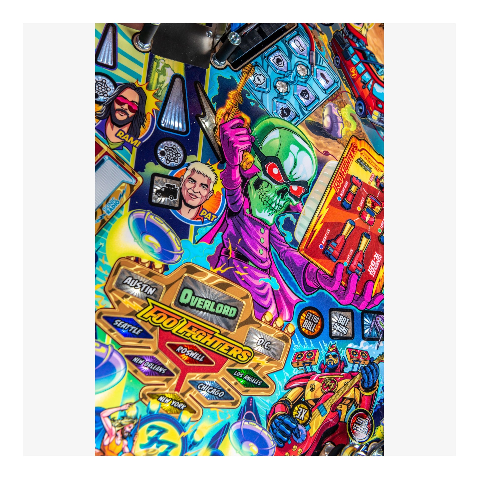 Colorful pinball machine with various characters and graphics on a white background