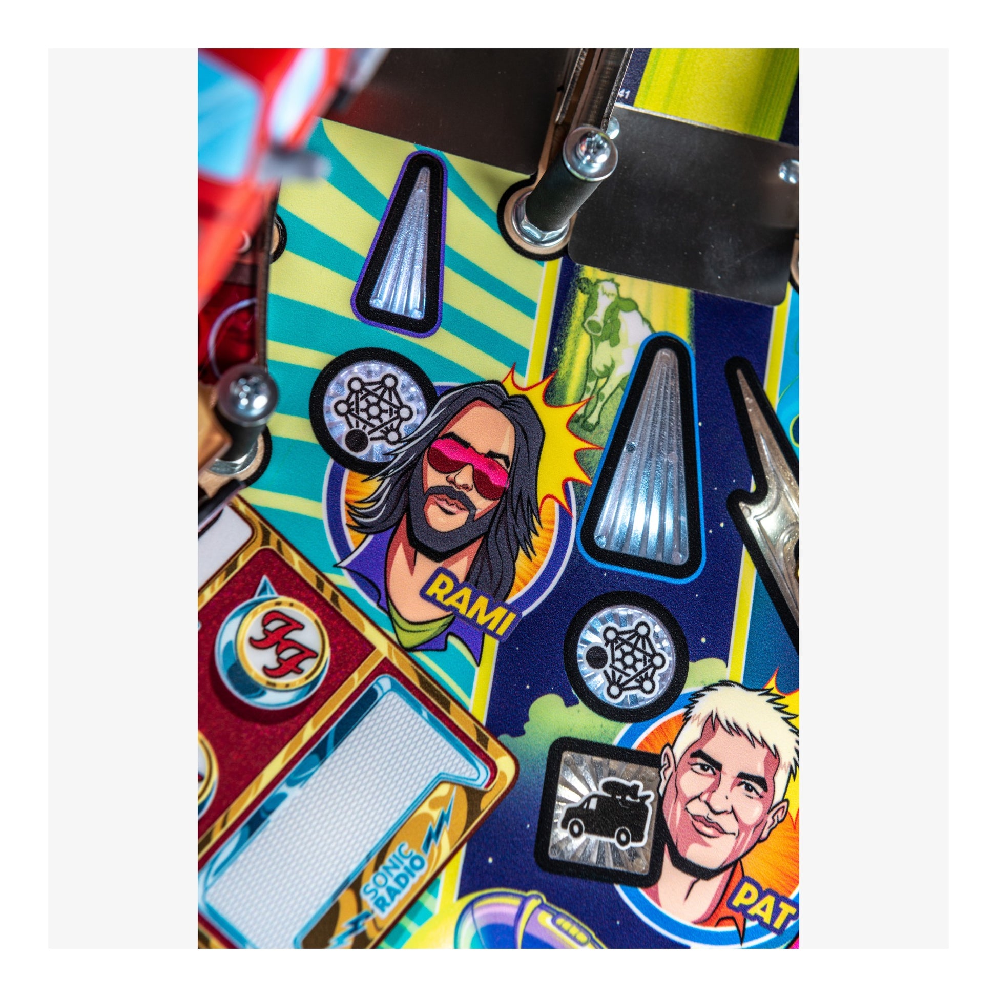 Colorful pinball machine with character stickers and text