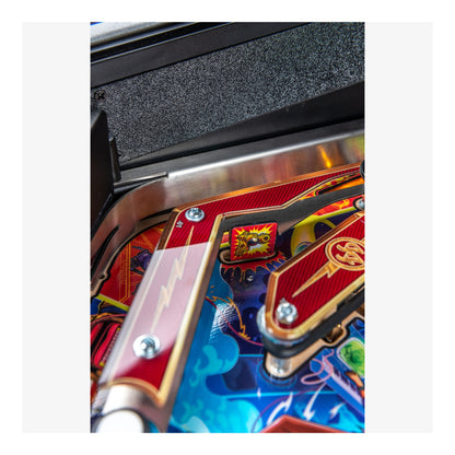 Close-up of a colorful pinball machine with detailed artwork
