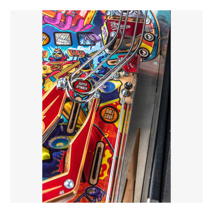 Close-up of a colorful pinball machine with various components.