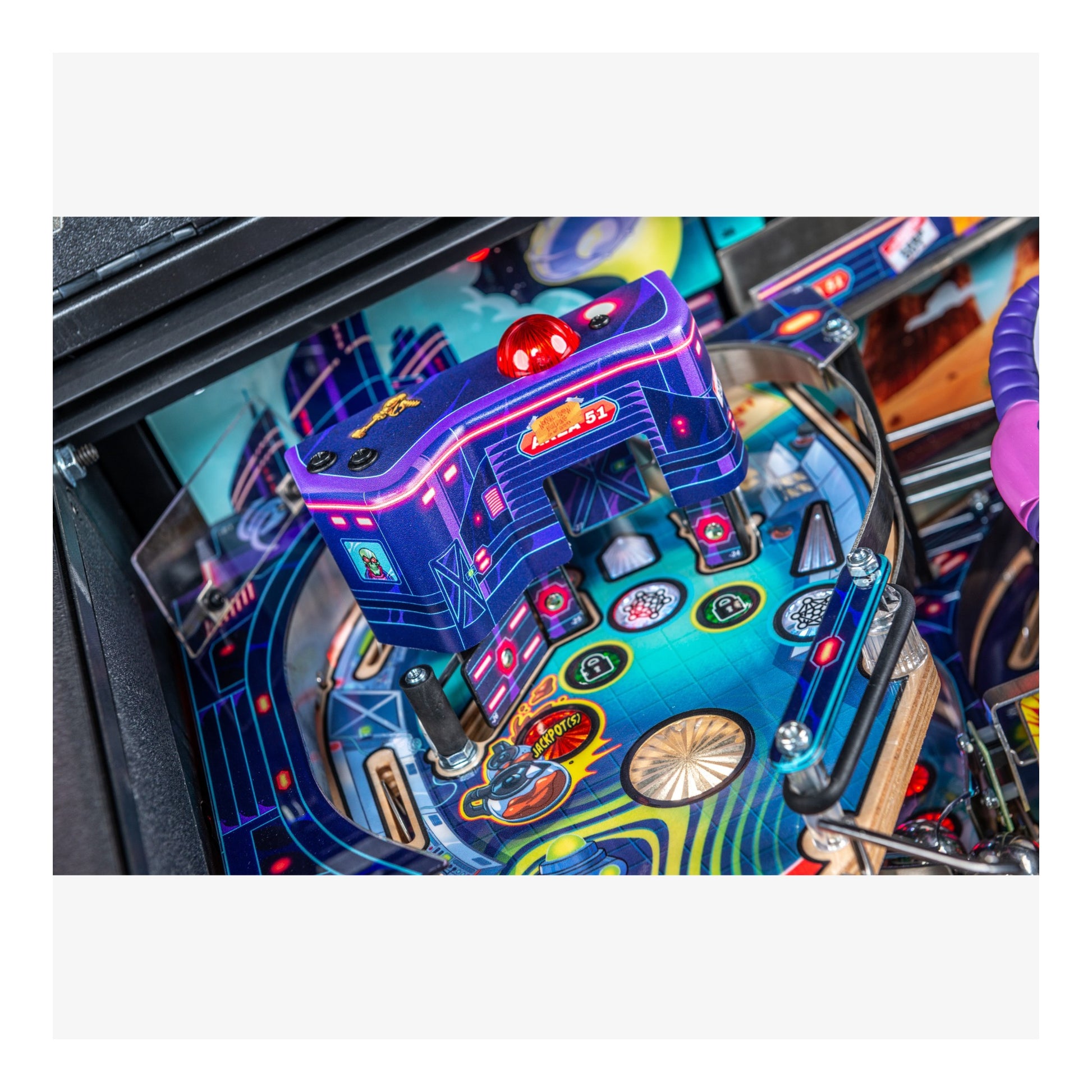 Close-up of a colorful pinball machine with vibrant lights and details.