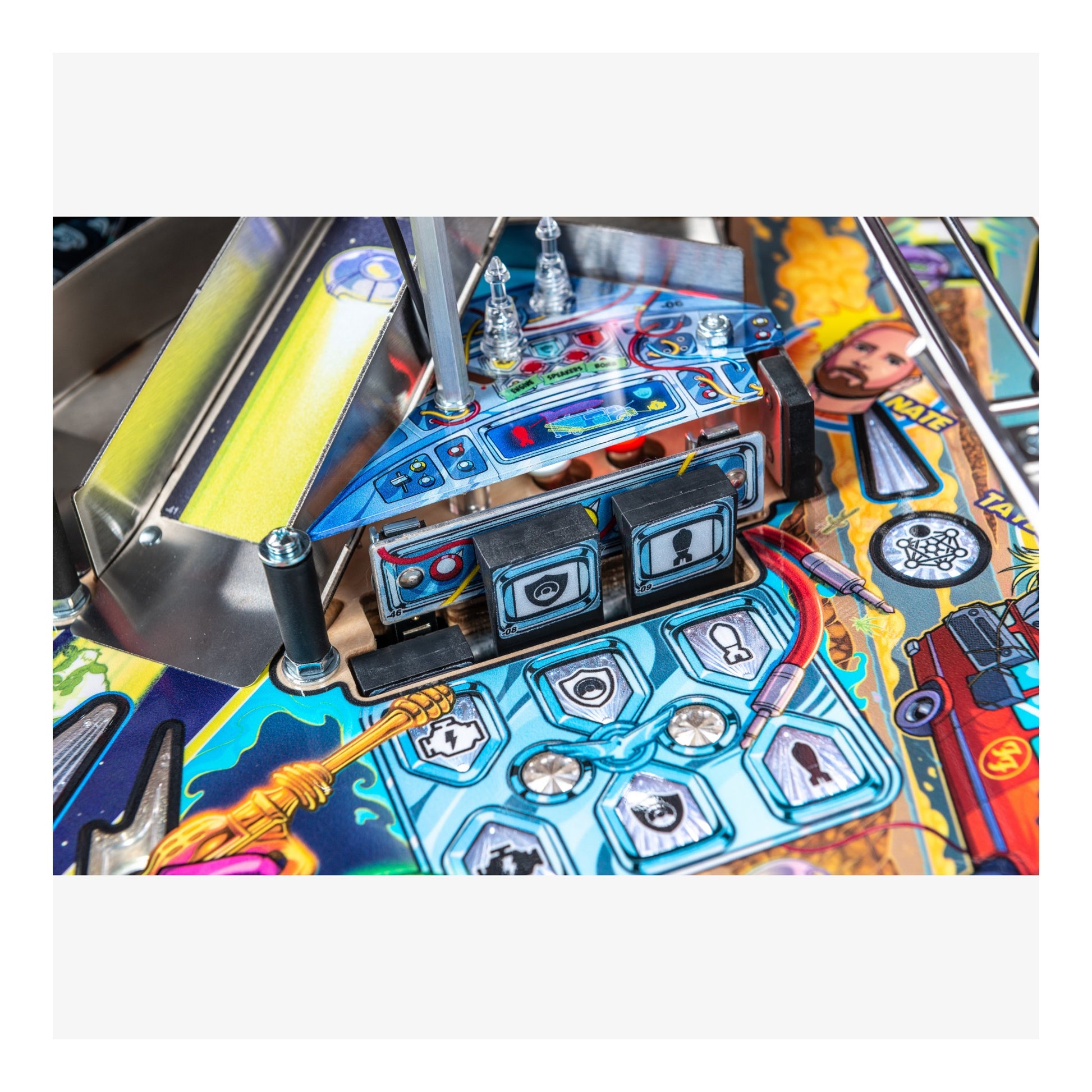 Close-up of a colorful pinball machine with various components.