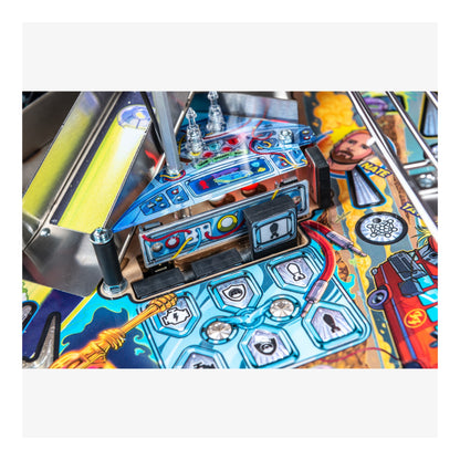 Close-up of a pinball machine with colorful artwork and mechanical components.