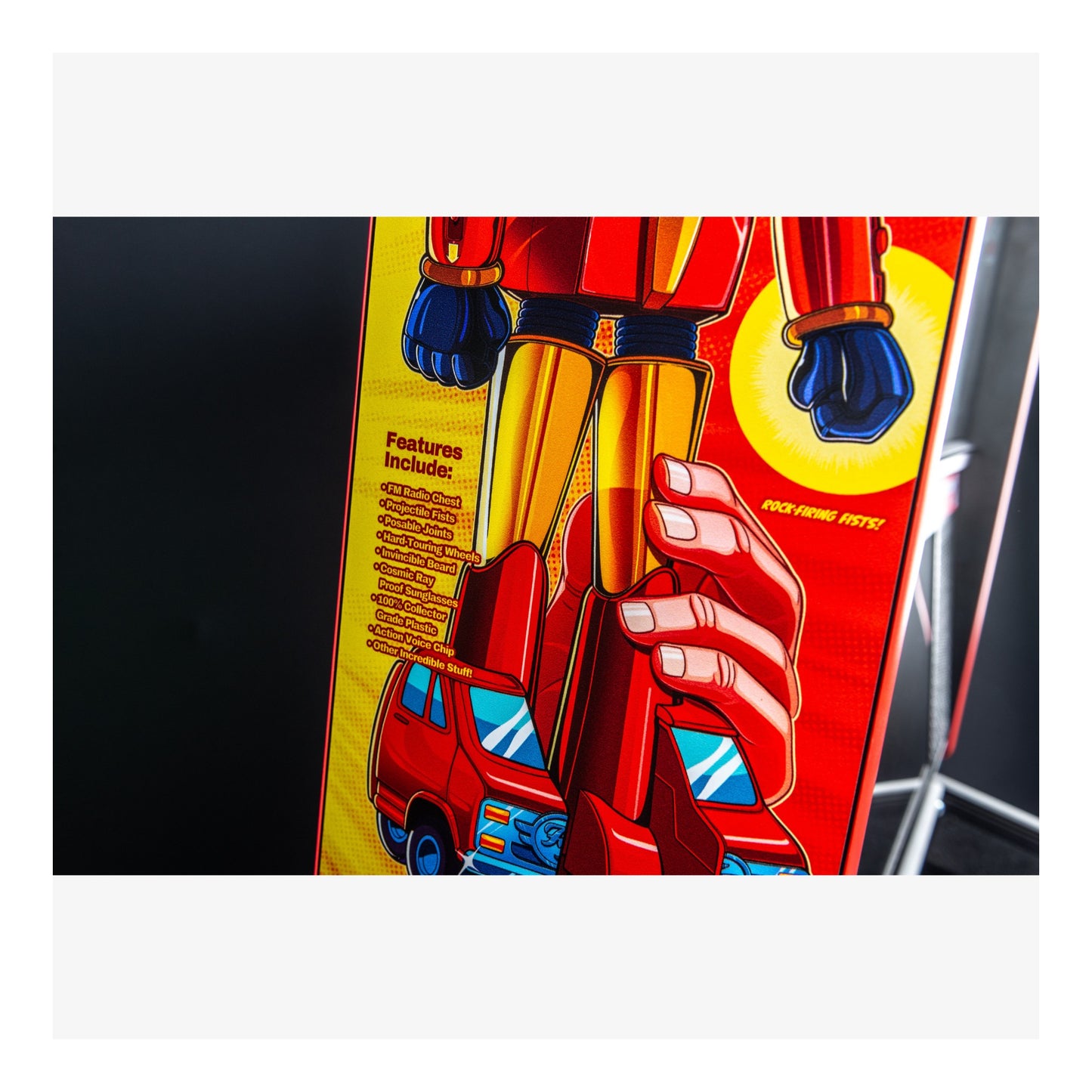 Toy figure with red and yellow colors on a black background