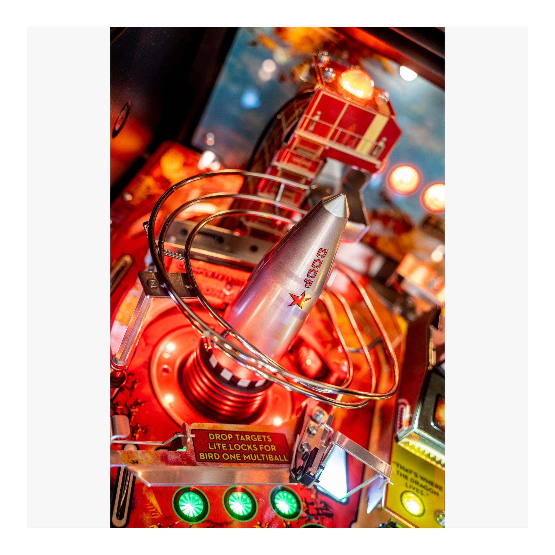 Close-up of a vintage pinball machine with bright lights and colorful design.
