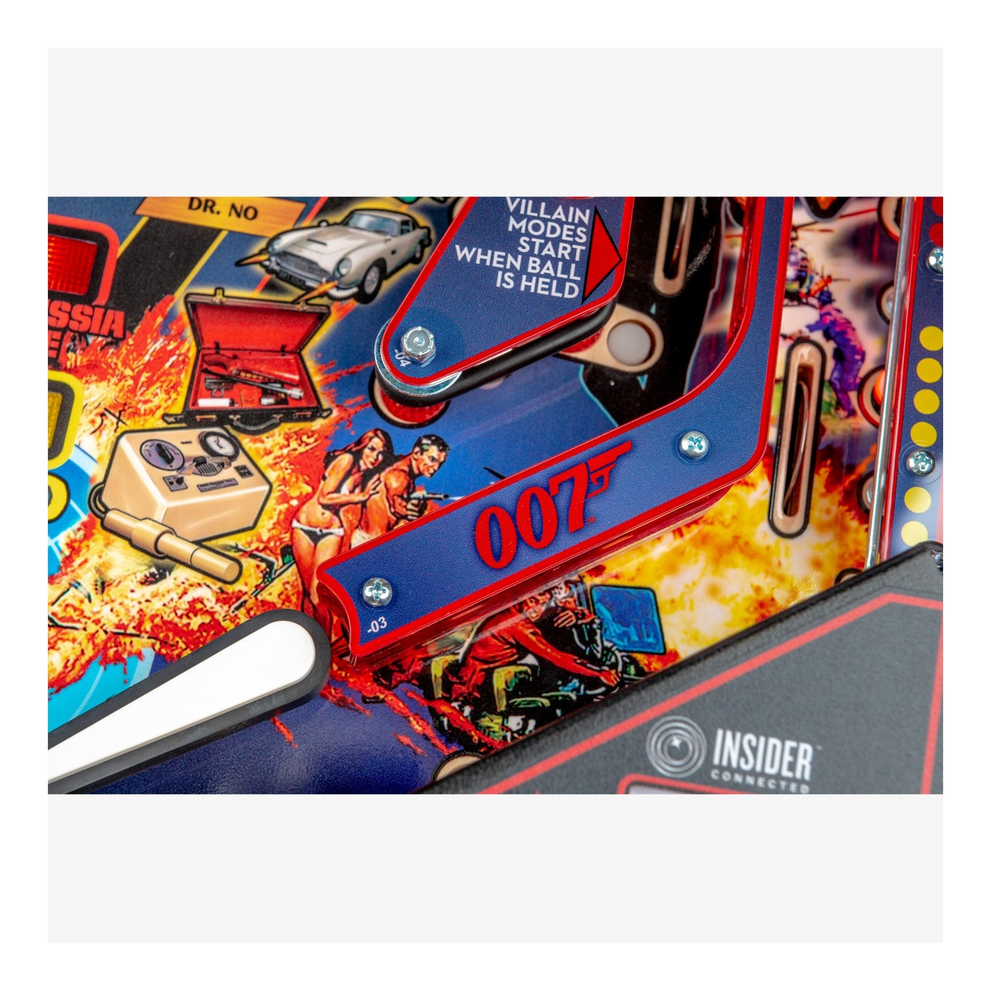 Close-up of a pinball machine with James Bond theme, featuring 007 branding.