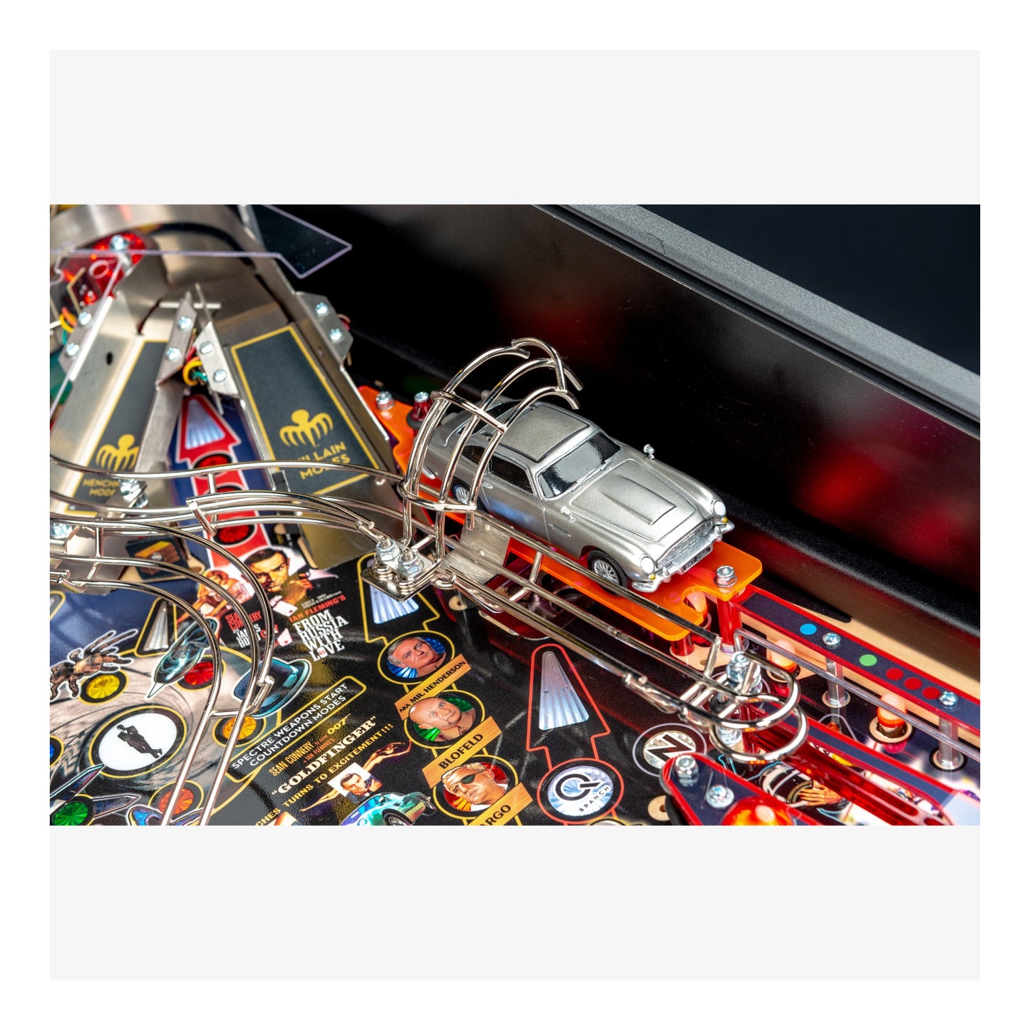 Pinball machine with a car figure on a colorful playfield