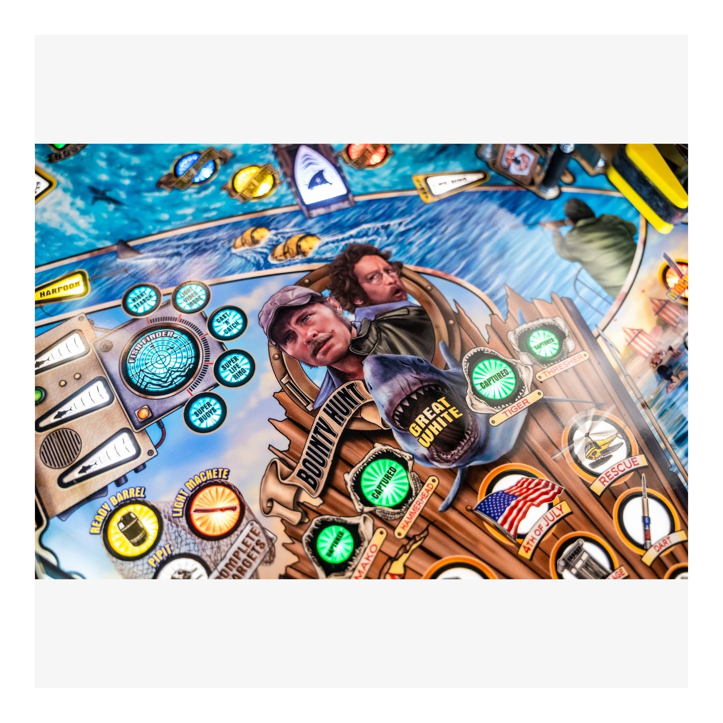 Pinball machine with colorful design and characters, featuring a blue sky and various objects.