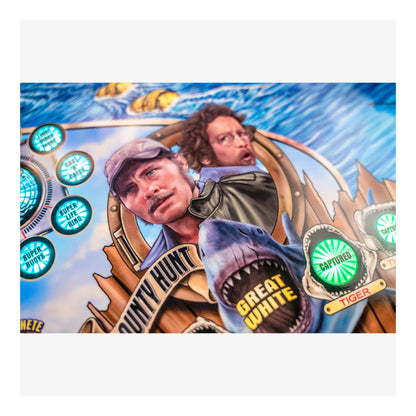 Slot machine reel with graphics of a shark and two people, featuring bright colors and text.