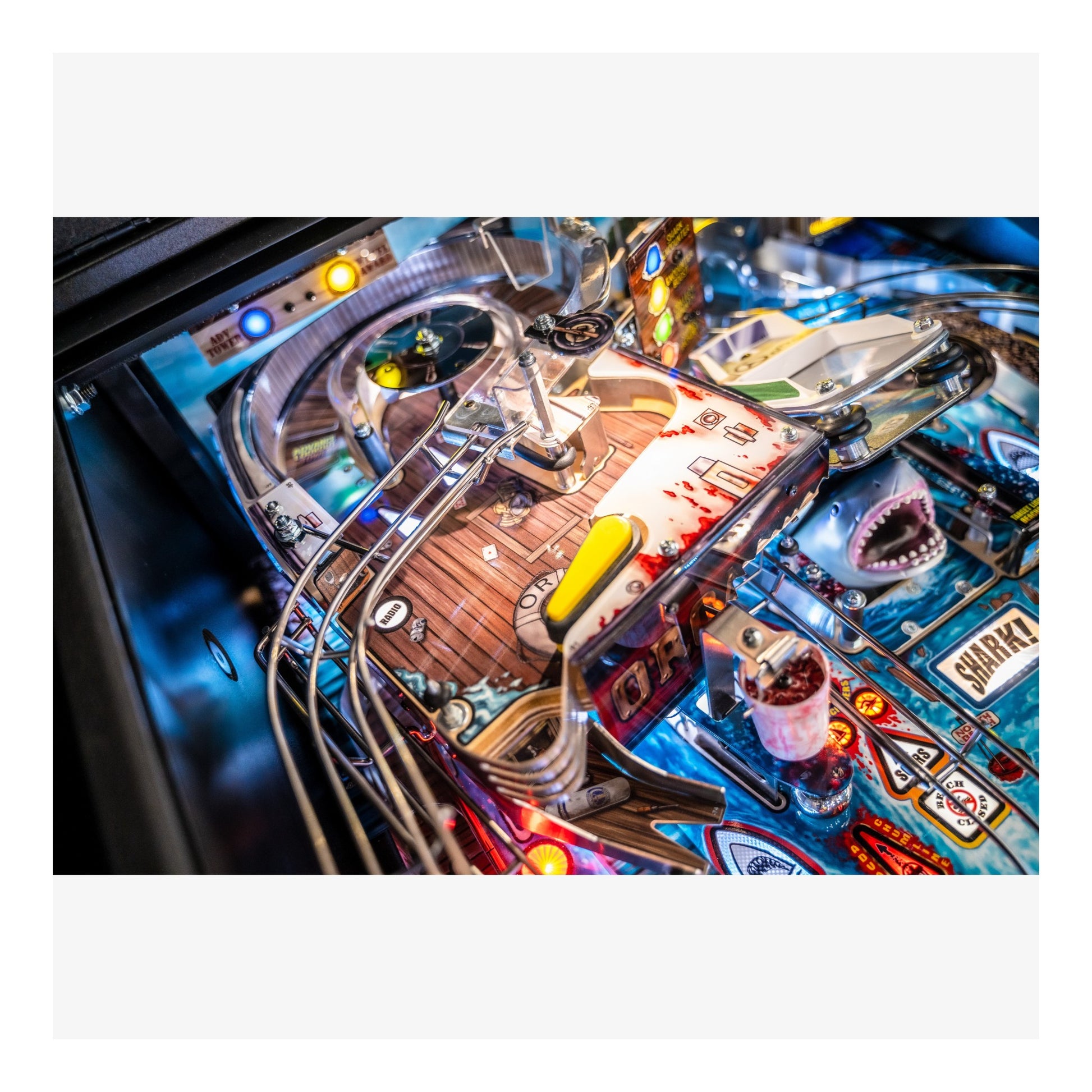 Close-up of a pinball machine with vibrant colors and detailed design.