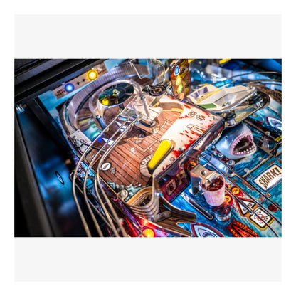 Close-up of a pinball machine with vibrant colors and detailed design.