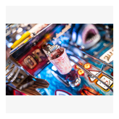 Close-up of a pinball machine with colorful details