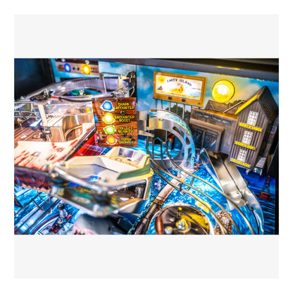 Close-up of a pinball machine with colorful lights and details