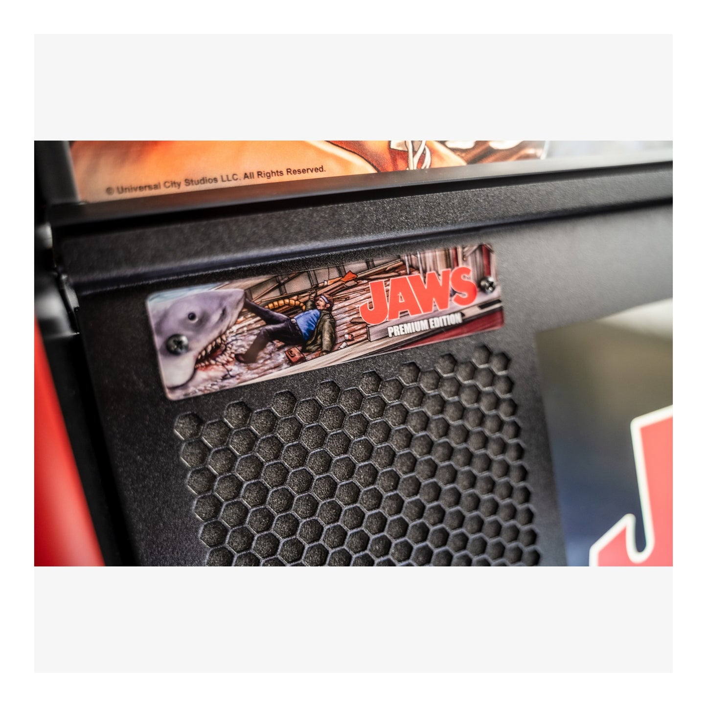 Close-up of a product with 'Jaws' branding on a textured surface.