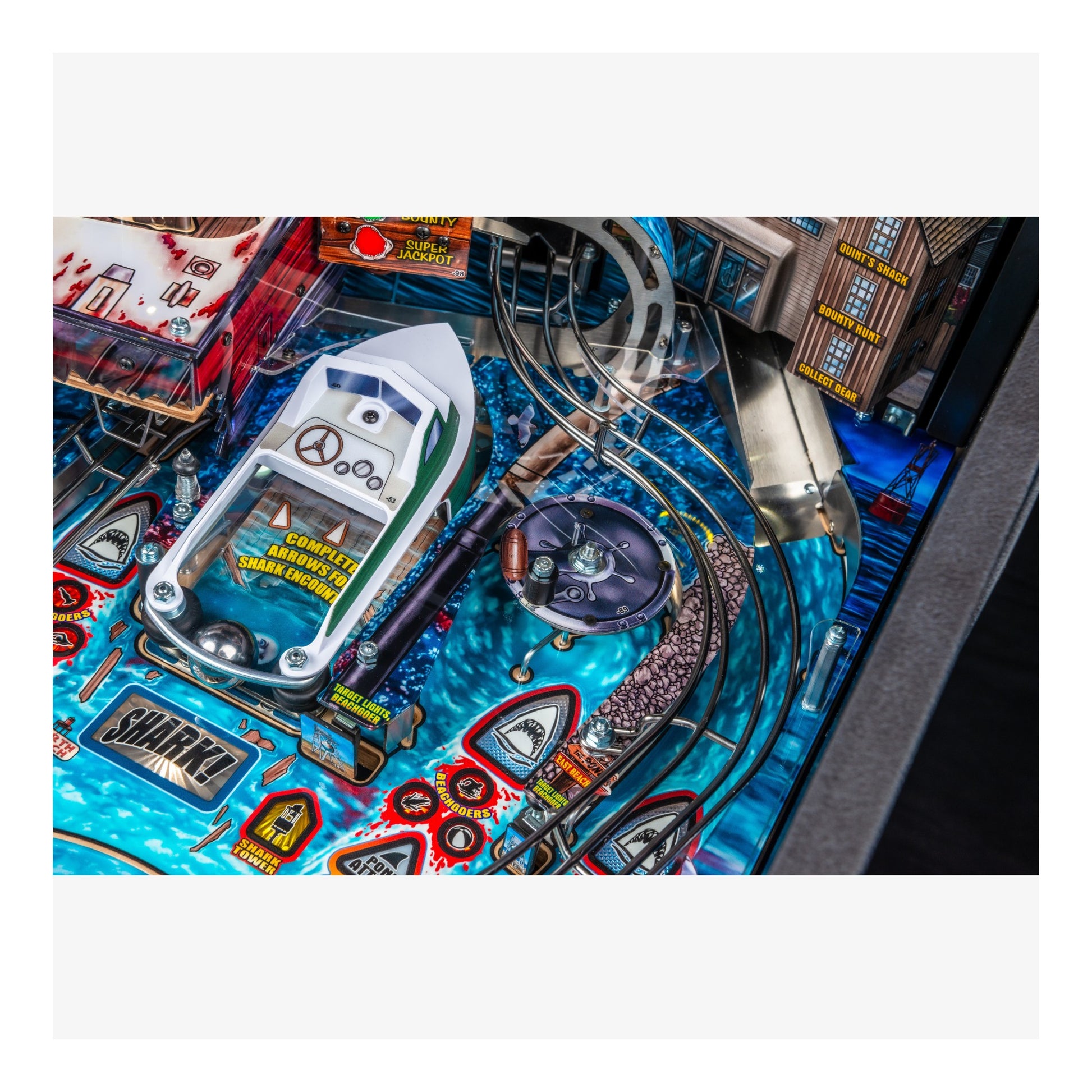 Close-up of a pinball machine with detailed artwork and components.