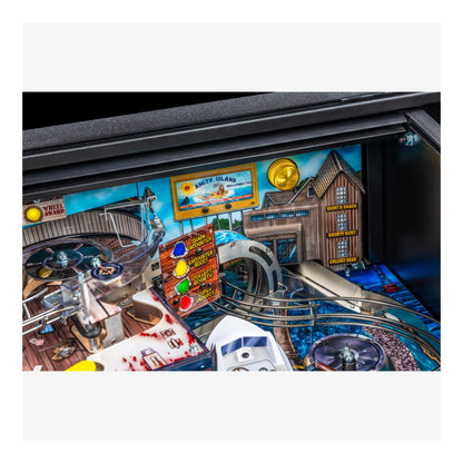 Close-up of a pinball machine with detailed artwork and player control panel.