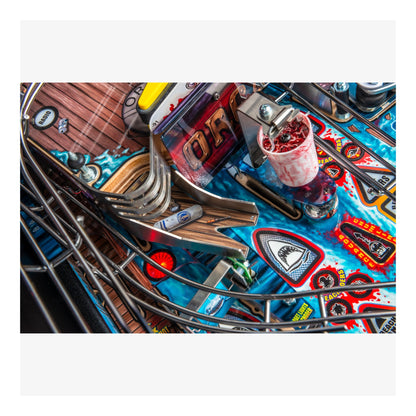 Close-up of a pinball machine with colorful marquee and playfield