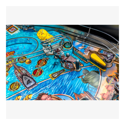 Close-up of a pinball machine with colorful design and various components.