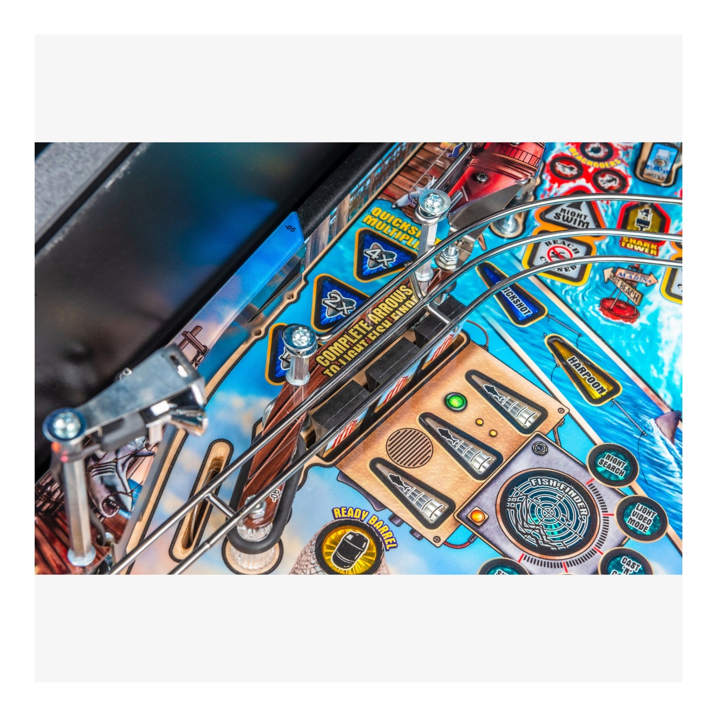Close-up of a pinball machine with detailed artwork and playfield.