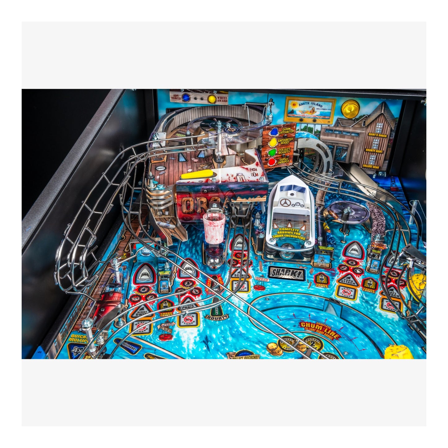 Close-up of a pinball machine with detailed artwork and playfield.
