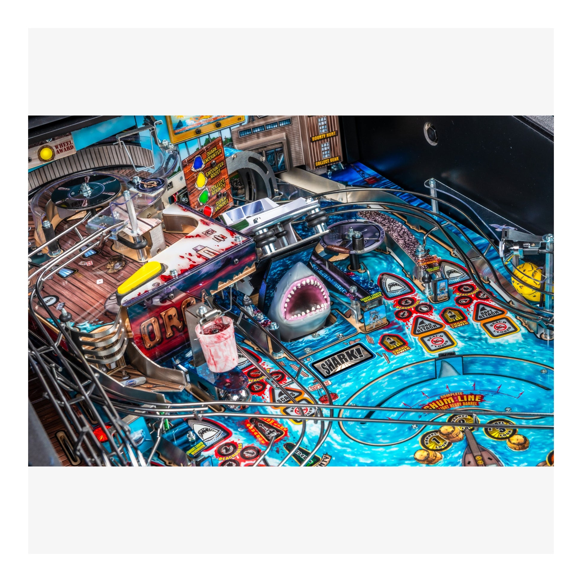 Pinball machine with shark character and colorful design