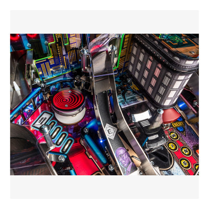 Close-up of a pinball machine with colorful details and mechanical components.