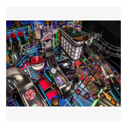 Close-up of a pinball machine with colorful playfield and various components.