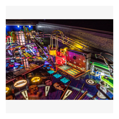 Close-up of a colorful pinball machine with vibrant lights and details.